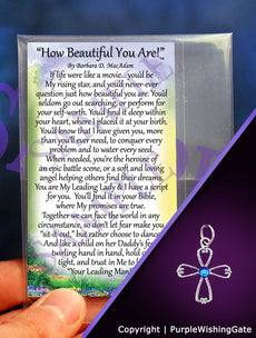Laminated card with an inspirational poem titled 'How Beautiful You Are,' and an angel-like cross with a royal blue crystal against a purple background.