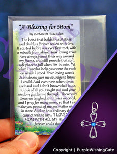 Small poem card titled 'A Blessing for Mom,' plus an angel-like cross with a royal blue crystal against a purple background.