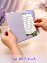 Example of a 5x7 Purple Wishing Gate blessing card held in hand while being pulled from a lavender gift envelope to show real-life size and presentation.