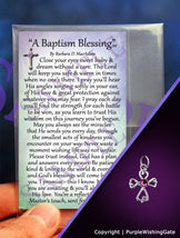 A wallet-size laminated card titled 'A Baptism Blessing,' shown with a small angel-like charm with a fuchsia crystal against a purple background.