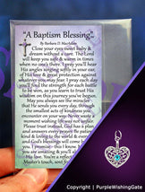 A wallet-size laminated card titled 'A Baptism Blessing,' shown with a heart-shaped charm with a Caribbean blue crystal against a purple background.