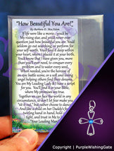 Laminated card with an inspirational poem titled 'How Beautiful You Are,' and an angel-like cross with a royal blue crystal against a purple background.