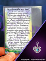 Laminated card with an inspirational poem titled 'How Beautiful You Are,' and a heart-shaped charm with a Caribbean blue crystal against a purple background.