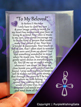 Laminated card with a love poem titled 'To My Beloved,' and an angel-like cross charm with a royal blue crystal on a purple background.