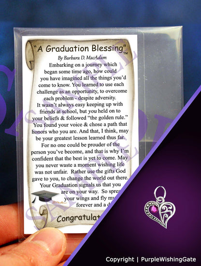 Wallet-size graduation blessing card, plus a crescent heart-shape charm with a fuchsia crystal against a purple background.