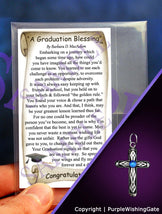 Wallet-size graduation blessing card, plus a heritage cross charm with a royal blue crystal against a purple background.