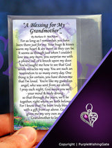 Wallet-size card with a grandmother's blessing, plus a crescent-shaped heart charm with a fuchsia crystal against a purple background.