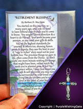 Retirement blessing card and a heritage cross pendant with a royal blue crystal on a purple background.