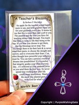 Teacher's blessing card with an angel style cross pendant and royal blue crystal on a purple background