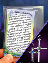 Two Wedding blessing cards with a silver rope cross for the groom and a heritage cross charm with blue crystal for the bride on a purple background